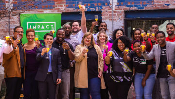 Entrepreneurs celebrate a 2019 Impact Ventures' cohort, photographed in the time before COVID. [Photo: Impact Ventures]